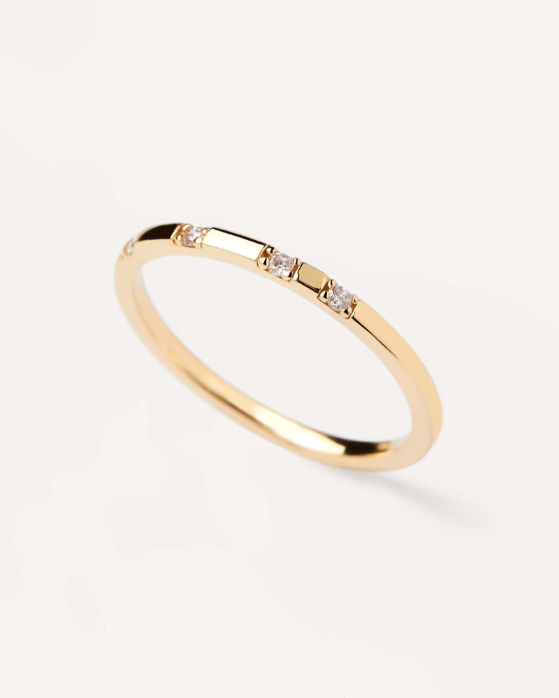 Solid yellow gold ring set with four lab-grown diamonds, equaling 0.06 carats
