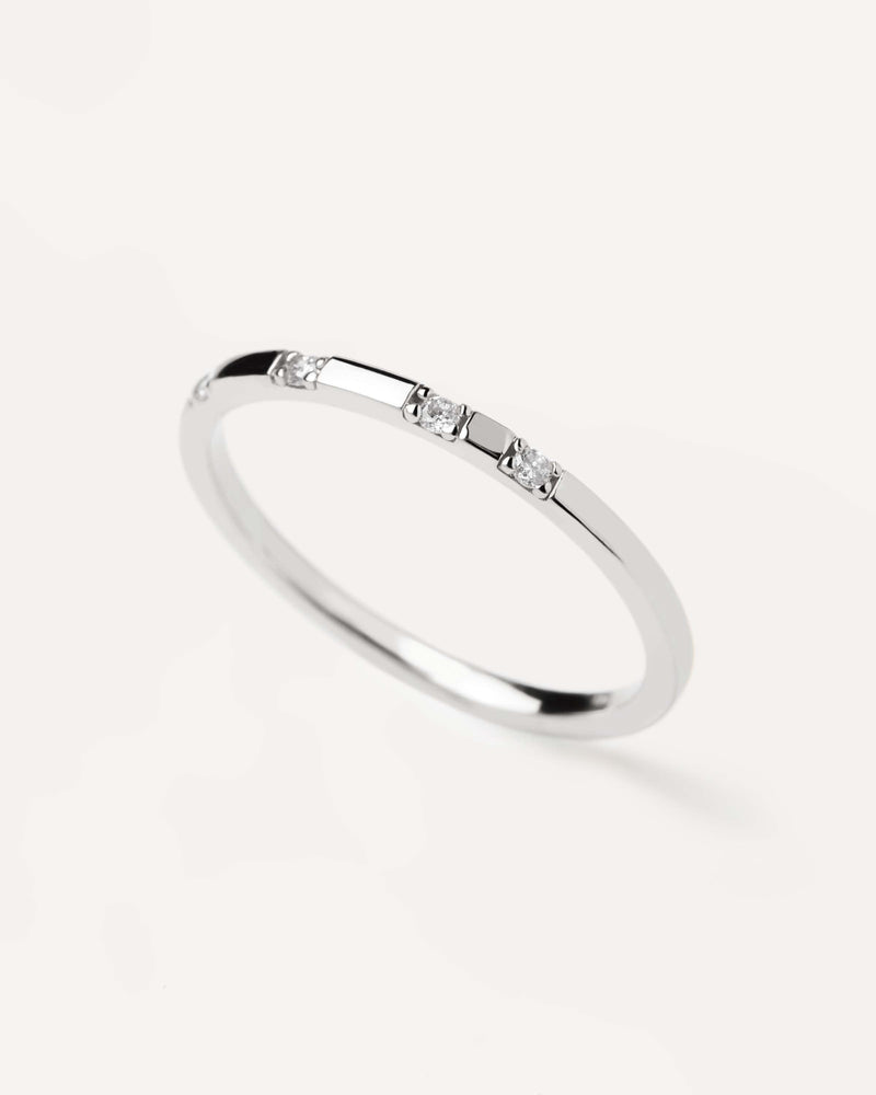 Solid white gold ring set with four lab-grown diamonds, equaling 0.06 carats