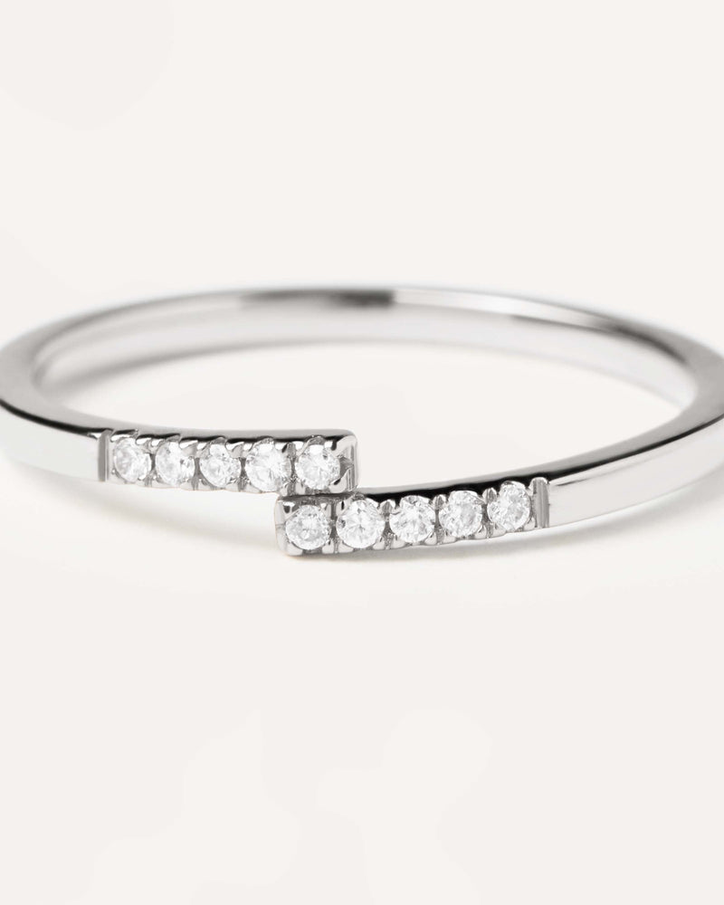 18K white gold ring with 10 dainty lab-grown diamonds meeting at the middle, equaling 0.06 carats