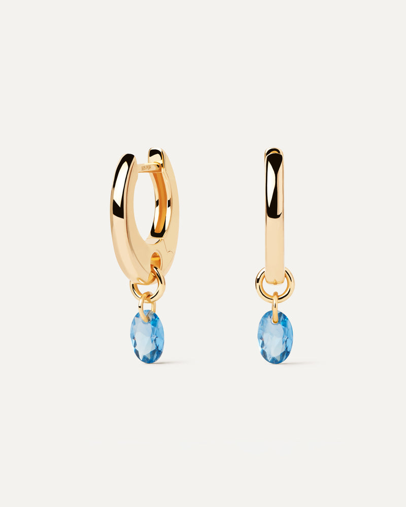 Gold-plated hoop earrings with a blue zirconia drop pendant