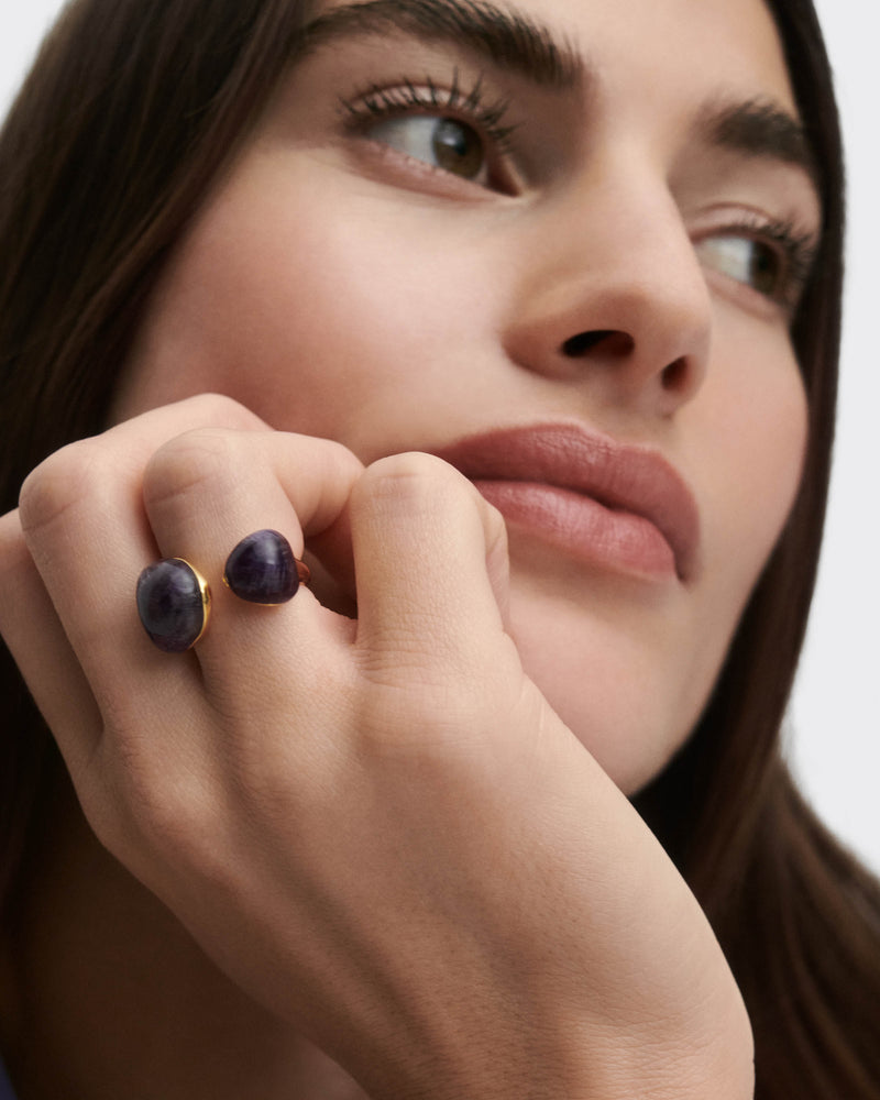 Gold-plated sculptural open ring embellished with two organic purple gemstones