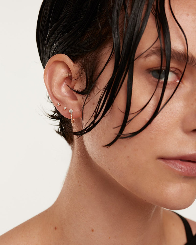 18K yellow gold earring set made of 2 diamond studs and a lab-grown diamond wrapper, making 0.29 carats