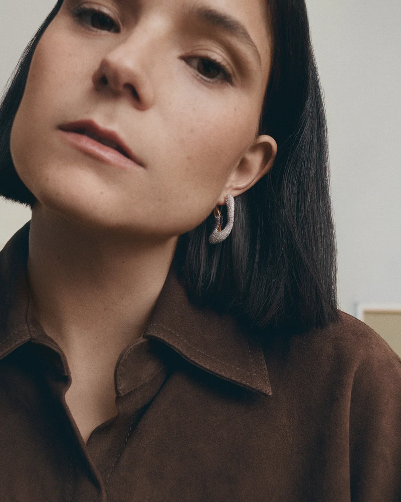 Gold-plated sculptural hoop earrings with abstract design set with pavé zirconia