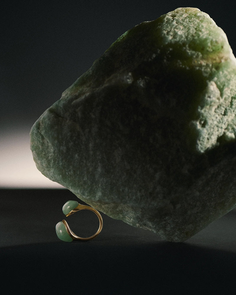 Gold-plated sculptural open ring embellished with two organic green gemstones