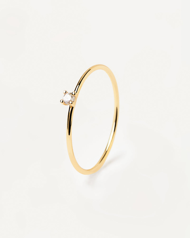 18k gold plated silver ring with a single round cut white zirconia