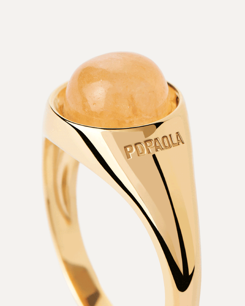 Gold-plated half sphere ring topped with an oval yellow gemstone