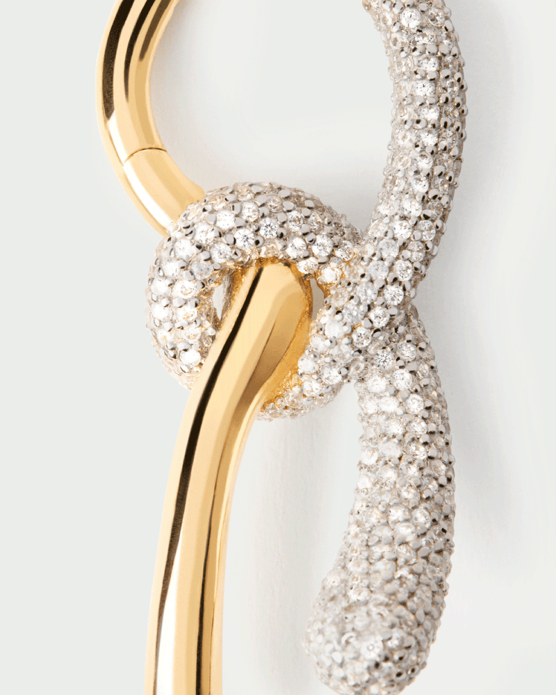 Elegant asymmetric hoop earrings with contrasting pavé zirconia knotted pendants