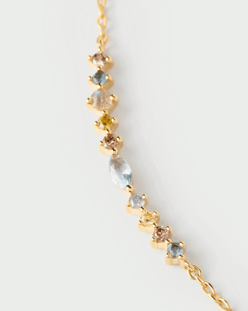 Gold-plated chain necklace set with multicolor zirconia that graduate in size and shape