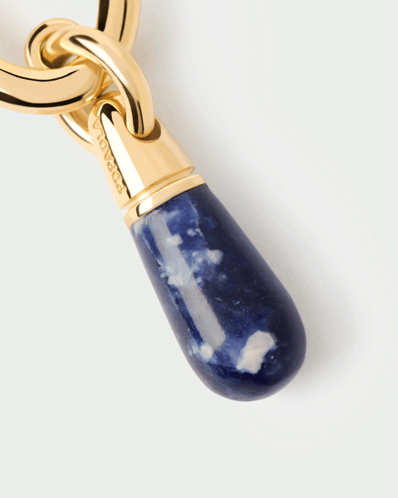Gold-plated single hoop with a small royal blue gemstone drop pendant