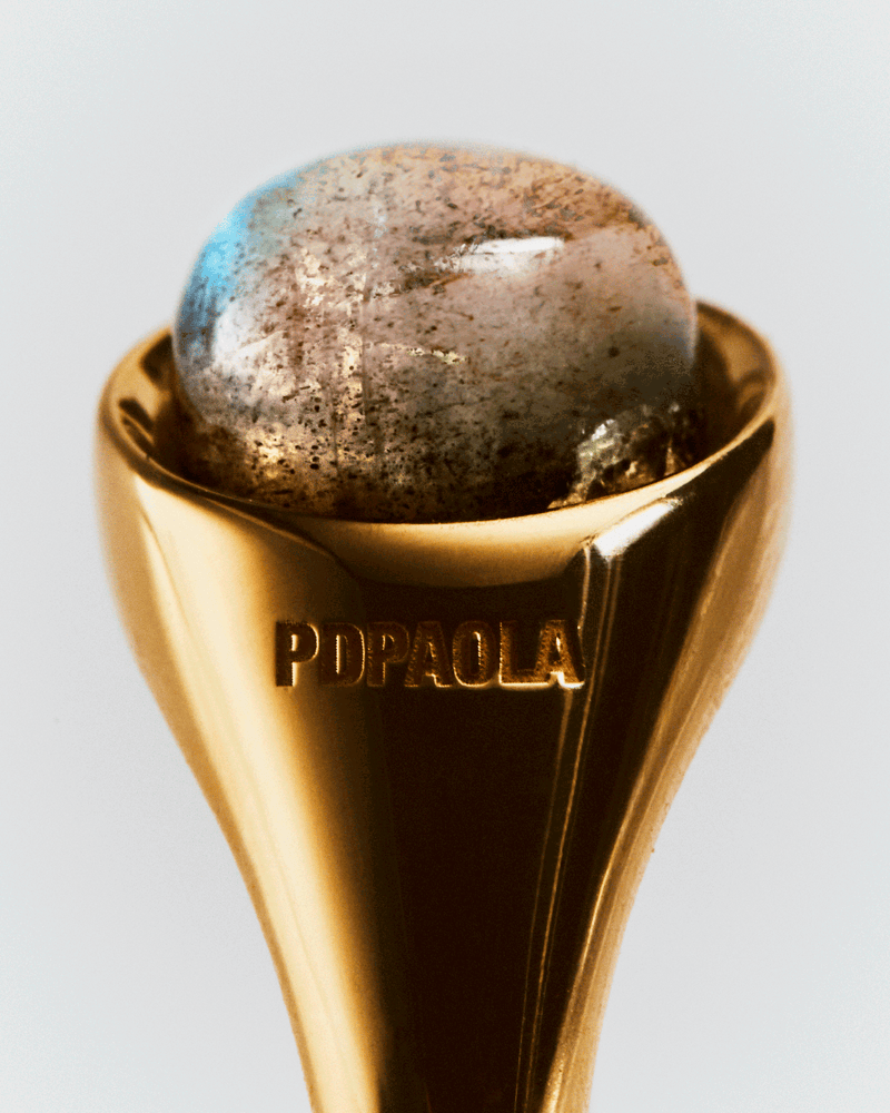 Gold-plated half sphere ring topped with an oval grey gemstone